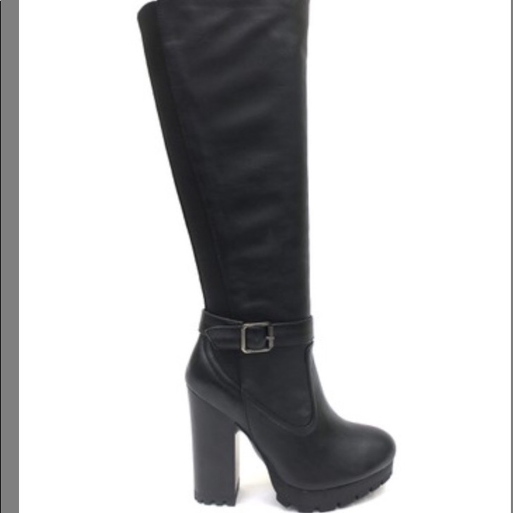 Black, up to the knee, heeled boots.
